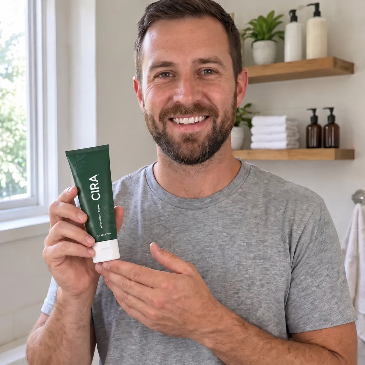 A Cira customer holding his tube
